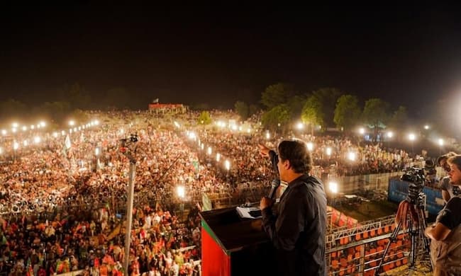 Caption: PTI Chairman Imran Khan addresses a rally in Jhelum in May 2022. — Imran Khan Twitter